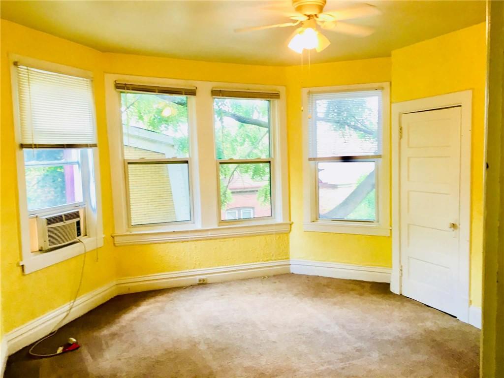 1911 Delaware Avenue Pittsburgh, PA 15218 - Photo 12 of 17 a view of an empty room with a window and a bathroom