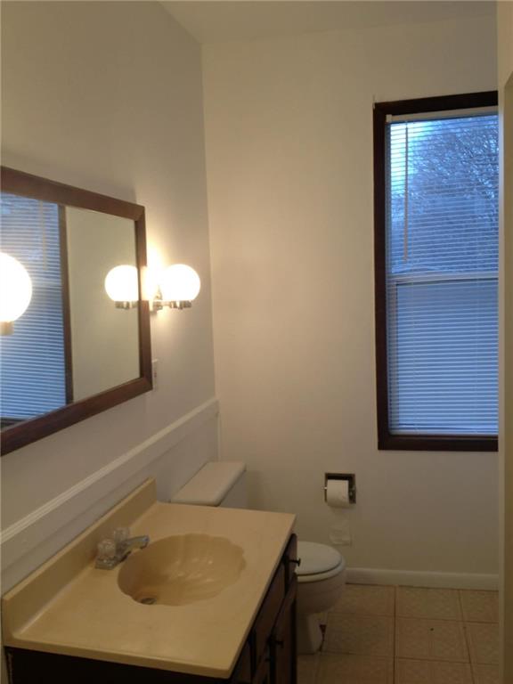 1911 Delaware Avenue Pittsburgh, PA 15218 - Photo 15 of 17 a bathroom with a sink and a mirror