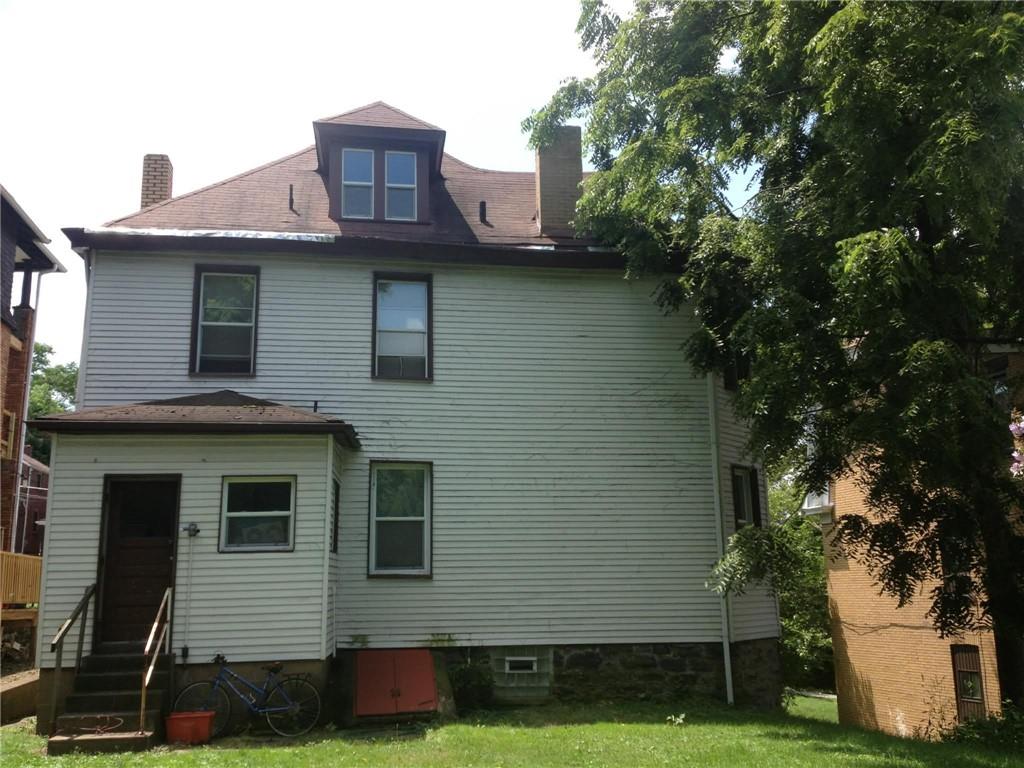 1911 Delaware Avenue Pittsburgh, PA 15218 - Photo 7 of 17 a front view of a house with garden