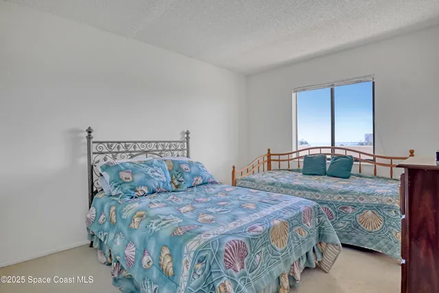 a bedroom with a bed and with furniture