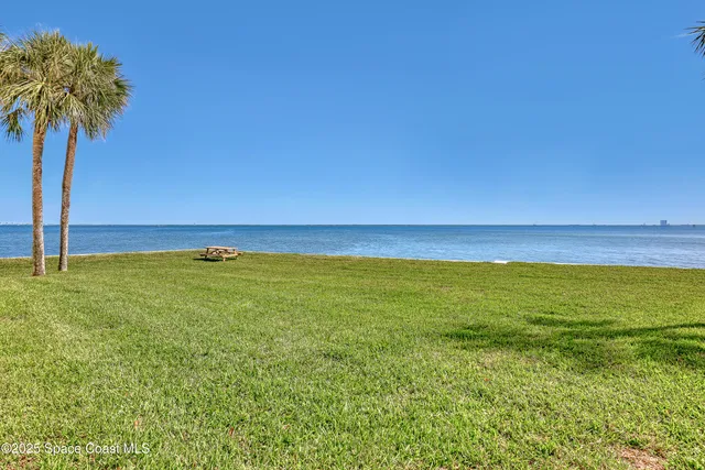 a view of a street with cars on road