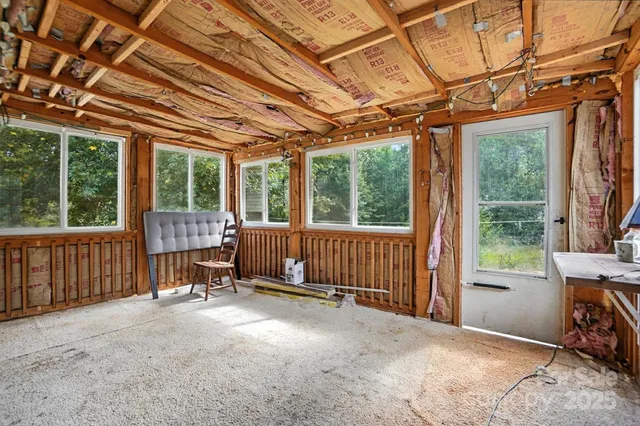 a view of a room with wooden walls and roof