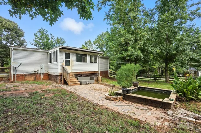 a house view with a backyard space