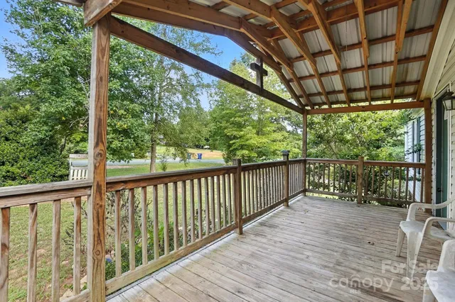 a balcony with trees in front of it