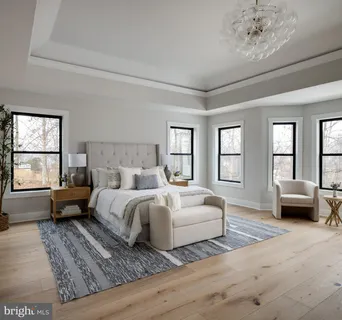 a bedroom with a large bed and a couch