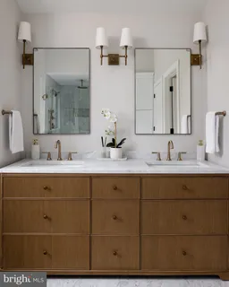 a bathroom with a sink and mirror