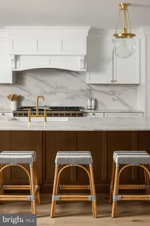 a view of kitchen with sink and cabinets