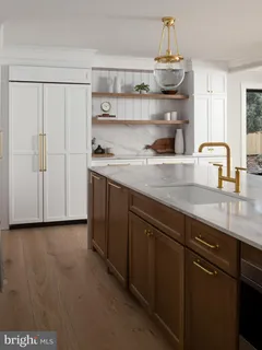 a kitchen with stainless steel appliances a sink and cabinets