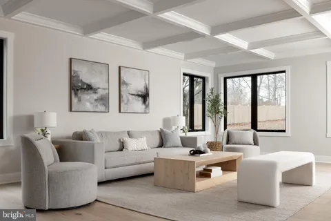 a living room with furniture and windows