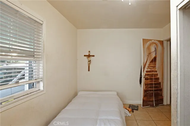a view of a livingroom with wooden floor and windows