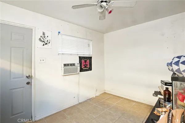 a view of a hallway with entryway and chandelier