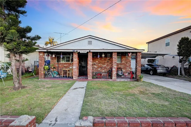 a view of a house with a yard porch and sitting area