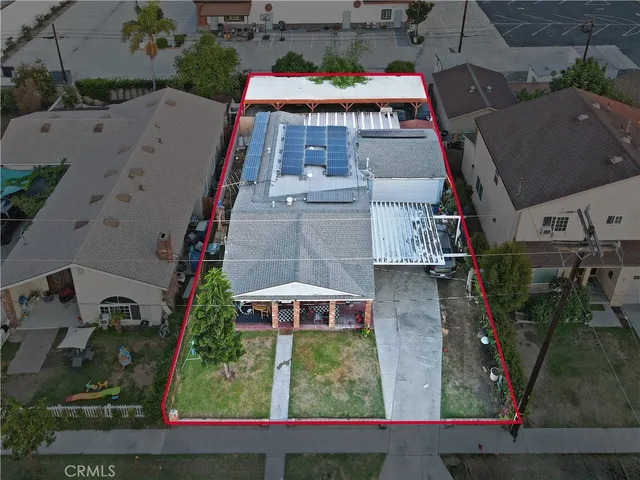 an aerial view of houses with outdoor space