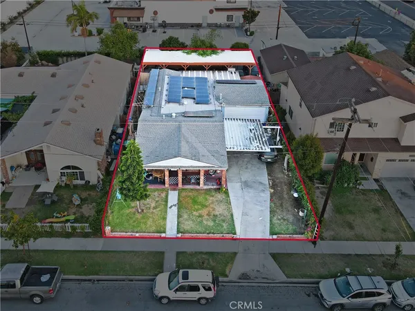 an aerial view of residential houses with outdoor space