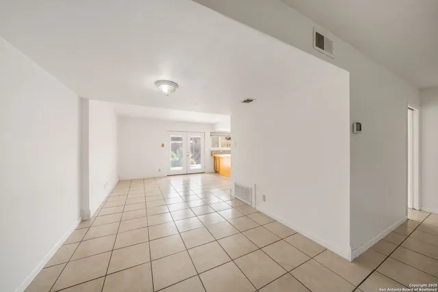 a view of an empty room and window