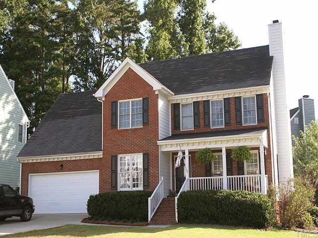9104 Dawnshire Road Raleigh, NC 27615 - Photo 1 of 1 a front view of a house with garden