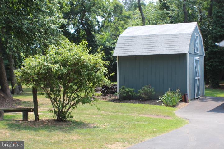 204 Thompson Road Chester, MD 21619 - Photo 1 of 30 a view of a house with backyard and trees