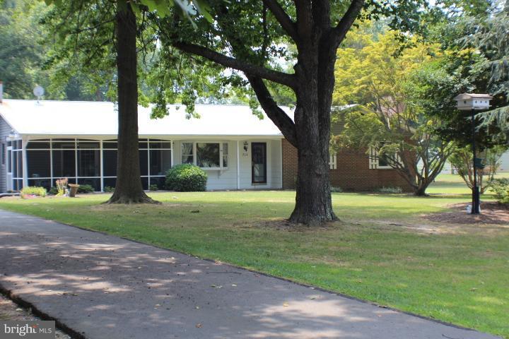 204 Thompson Road Chester, MD 21619 - Photo 16 of 30 a view of house in front of a big yard with large trees