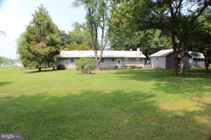204 Thompson Road Chester, MD 21619 - Photo 20 of 30 a view of a house with a big yard and large trees