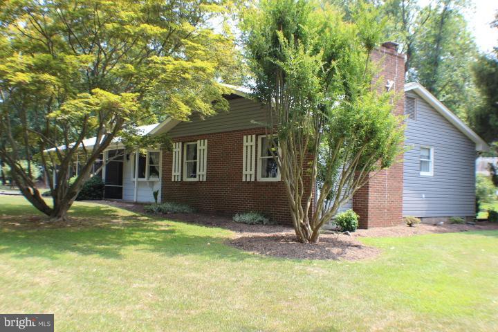 204 Thompson Road Chester, MD 21619 - Photo 3 of 30 a front view of a house with a yard