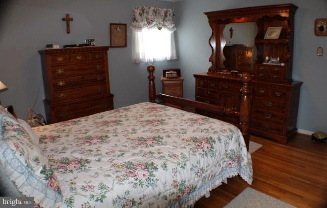204 Thompson Road Chester, MD 21619 - Photo 25 of 30 a bedroom with a bed and a dresser