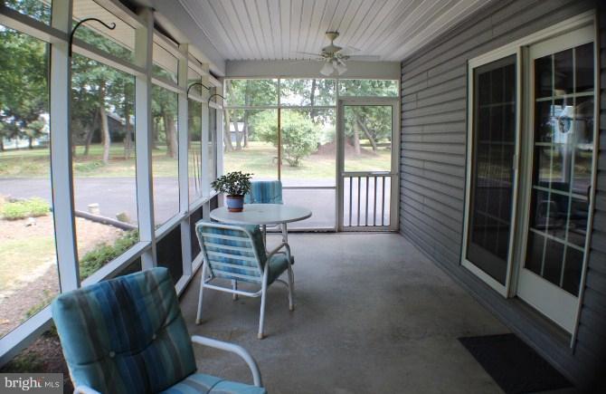 204 Thompson Road Chester, MD 21619 - Photo 26 of 30 a balcony with couple of chairs and a swing