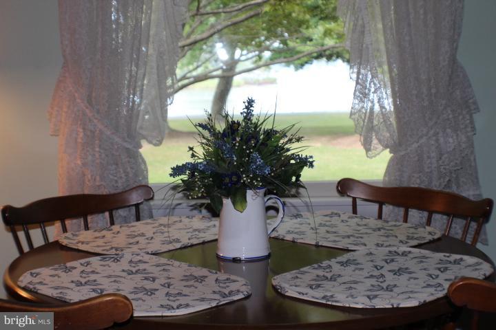 204 Thompson Road Chester, MD 21619 - Photo 28 of 30 a view of a dining room with furniture window and wooden floor