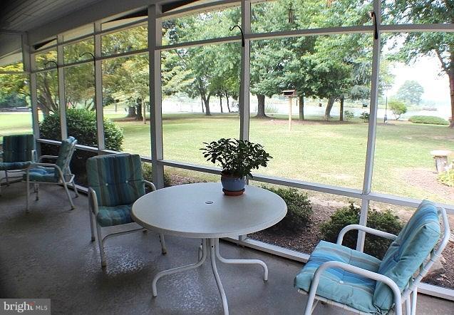 204 Thompson Road Chester, MD 21619 - Photo 7 of 30 a view of a dining room with furniture window and outside view