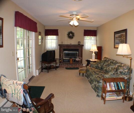 204 Thompson Road Chester, MD 21619 - Photo 8 of 30 a living room with furniture and a fireplace
