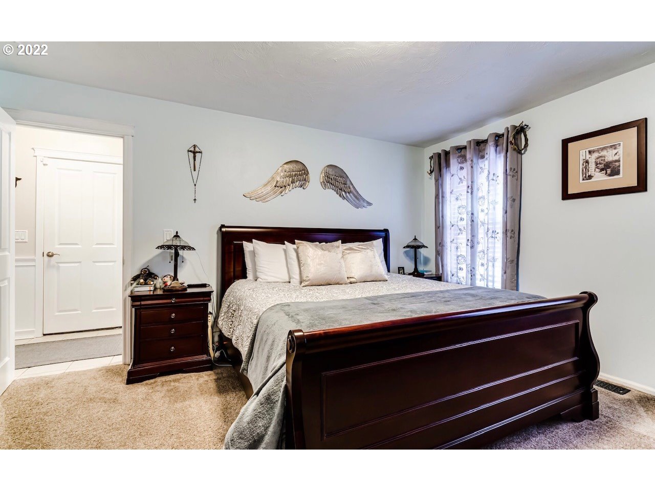 756 South 48th Street Springfield, OR 97478 - Photo 20 of 31 a bedroom with a bed and a chandelier