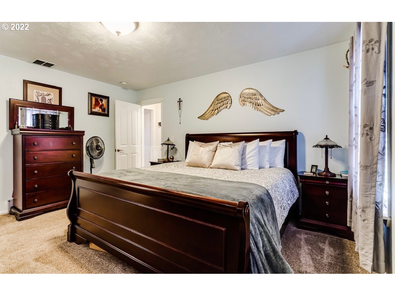 756 South 48th Street Springfield, OR 97478 - Photo 21 of 31 a bedroom with a bed and paintings on the wall
