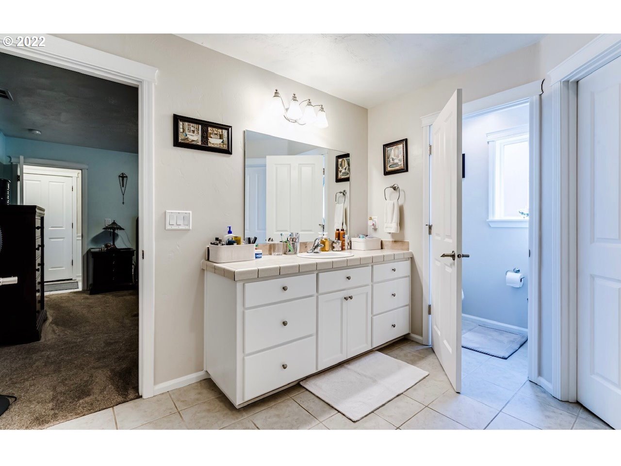 756 South 48th Street Springfield, OR 97478 - Photo 23 of 31 a spacious bathroom with a granite countertop sink mirror and toilet