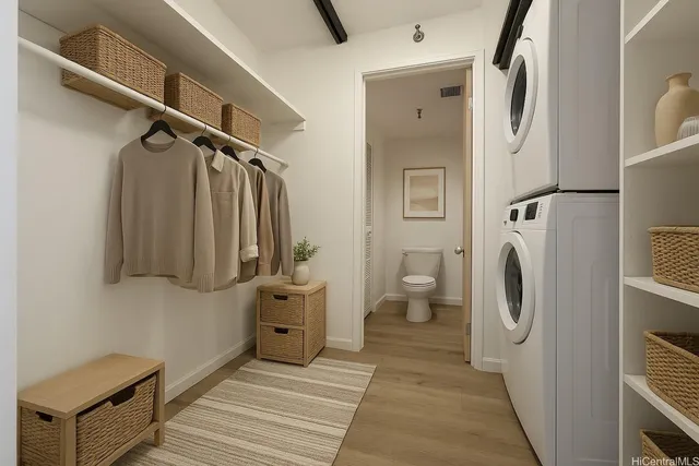 a view of a storage and utility room with washer and dryer