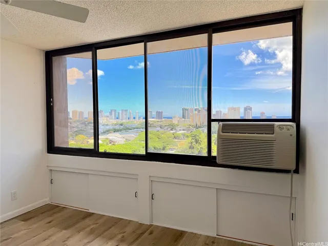 a view of a room with kitchen from a window