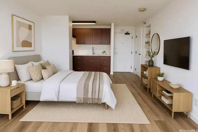 a spacious bedroom with a bed and a flat screen tv