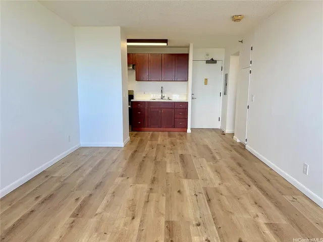 a view of kitchen with wooden floor