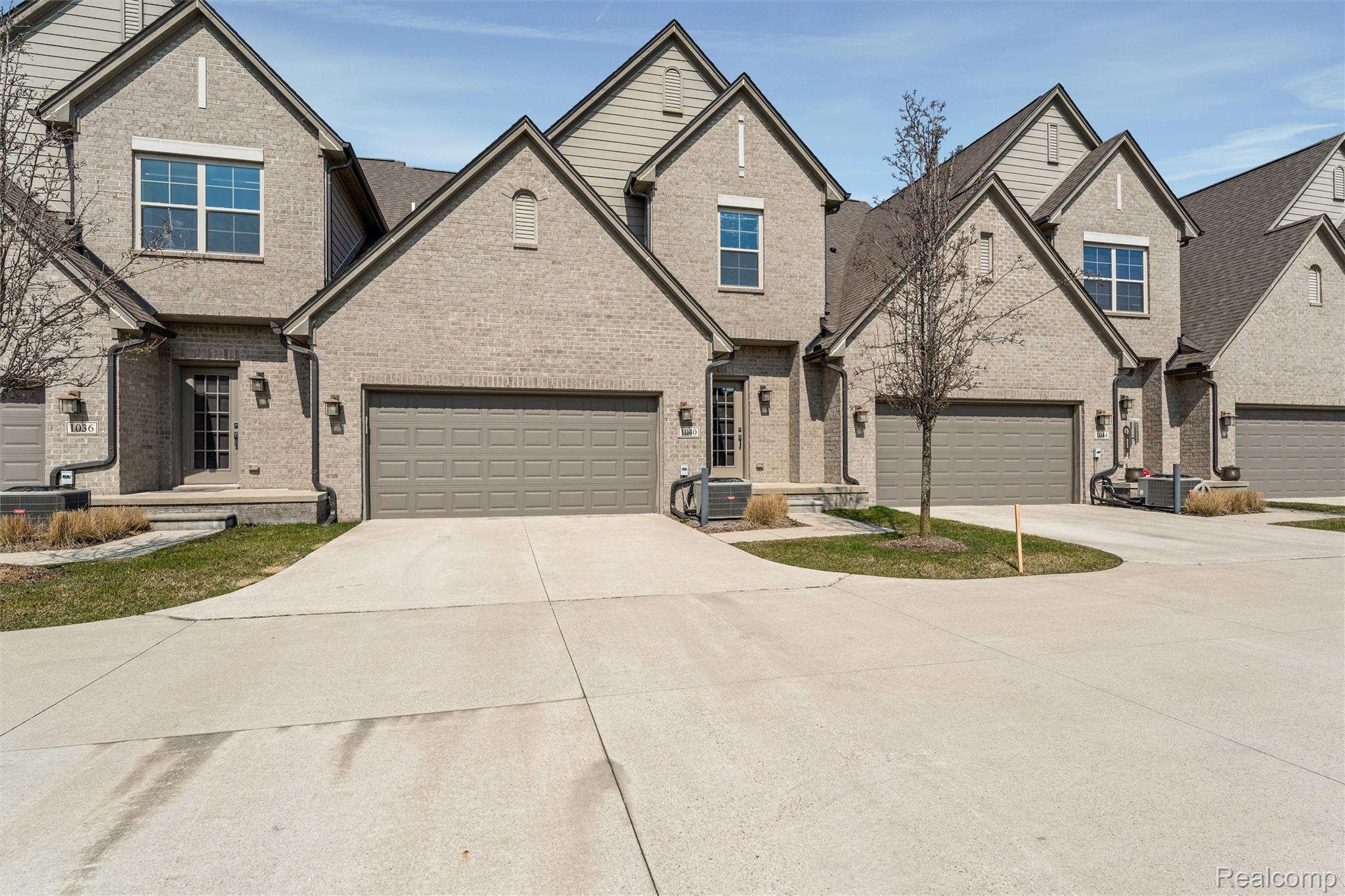 1040 Lamb Road, Unit # 5 Troy, MI 48085 - Photo 21 of 30 Traditional-style home with brick siding, driveway, and a garage