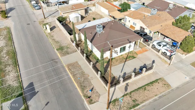 an aerial view of a house with outdoor space