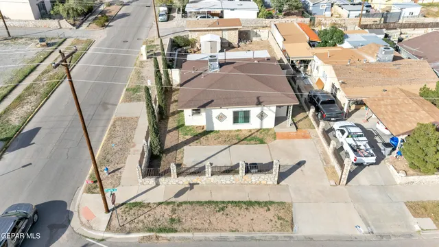 an aerial view of a house with a yard