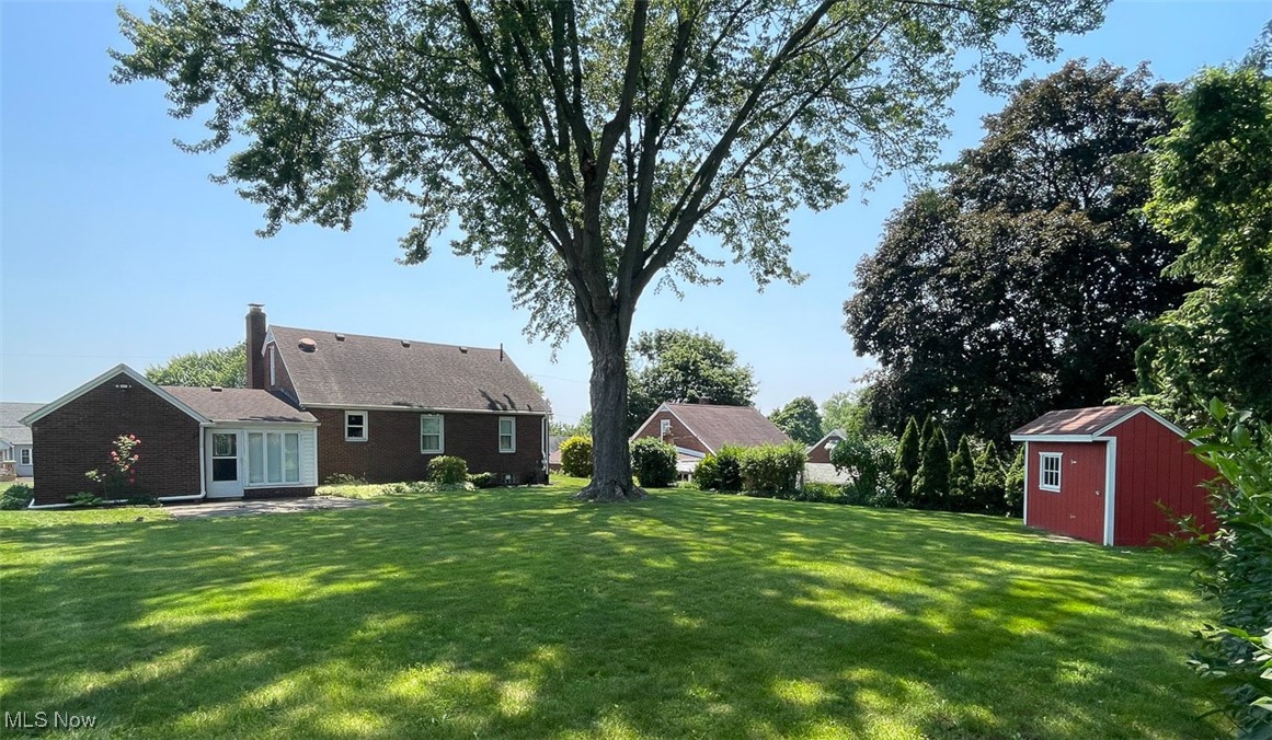 4425 2nd Street Northwest Canton, OH 44708 - Photo 3 of 24 View of green lawn featuring a shed