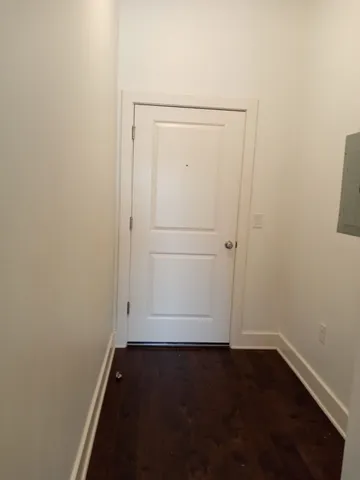 an empty room with wooden floor