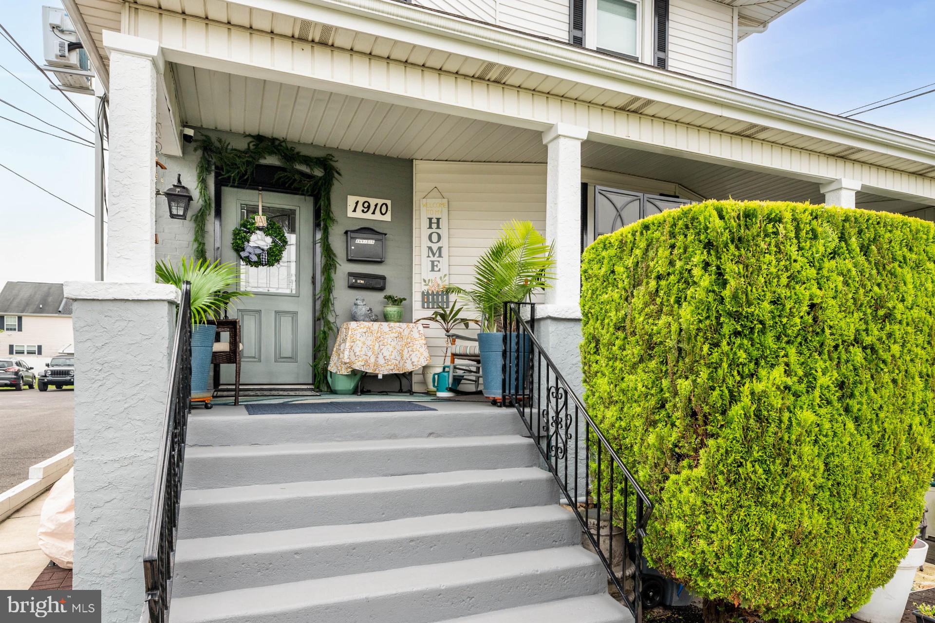 a view of a building with potted plants