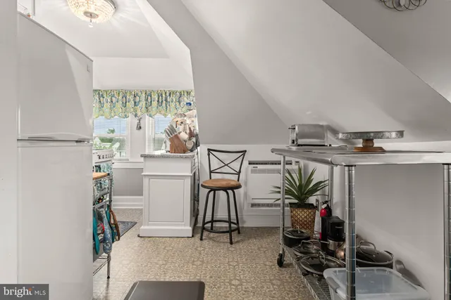 a view of a workspace with furniture