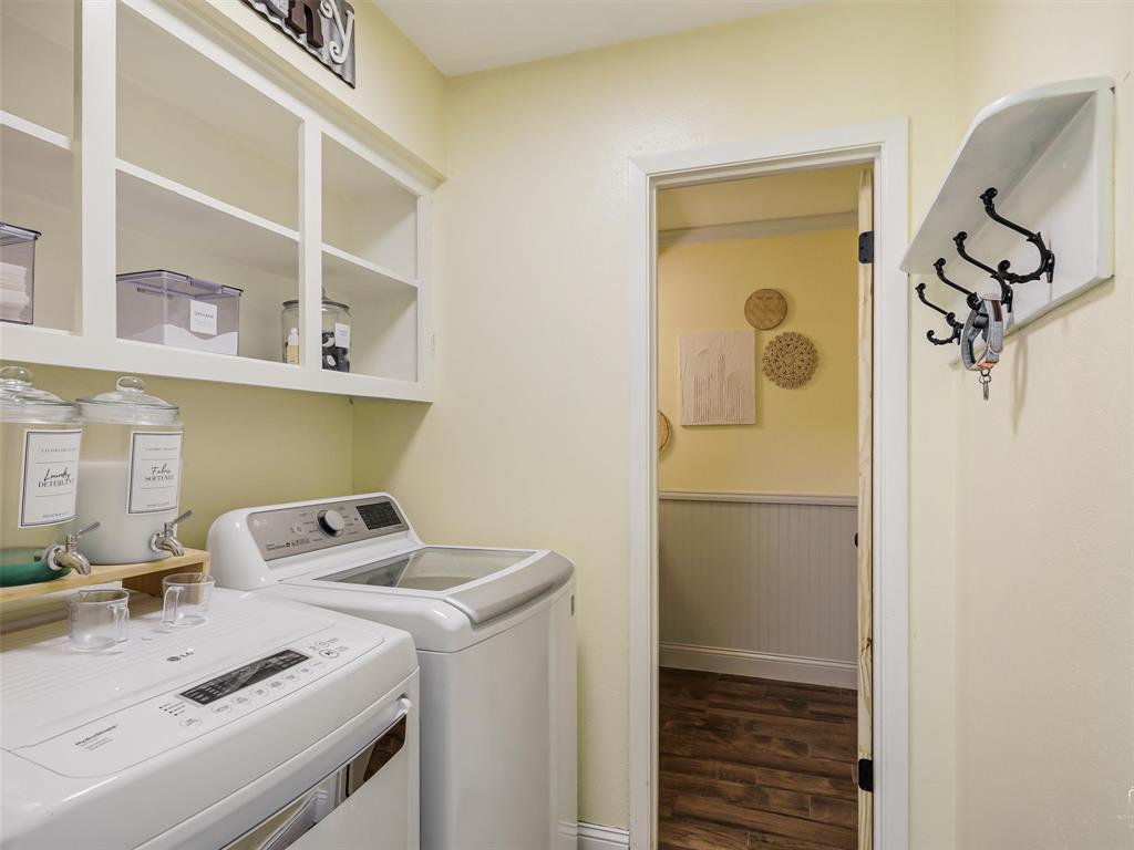 62 Sanders Road Whitesboro, TX 76273 - Photo 15 of 19 A bright and functional laundry space offers built-in storage and convenience for everyday living.