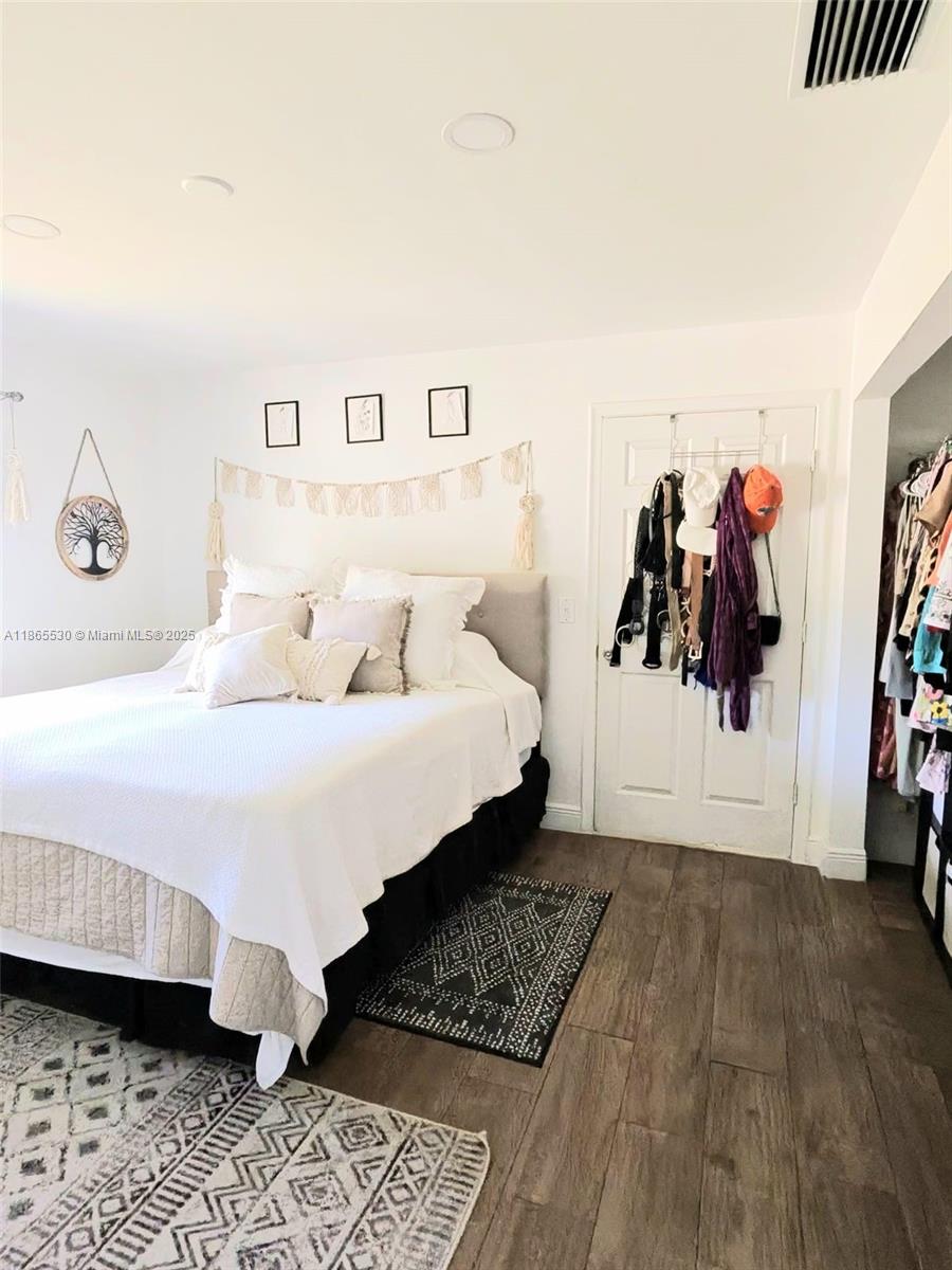 6120 Edwards Road Margate, FL 33063 - Photo 23 of 47 a bedroom with a bed and a walk in closet