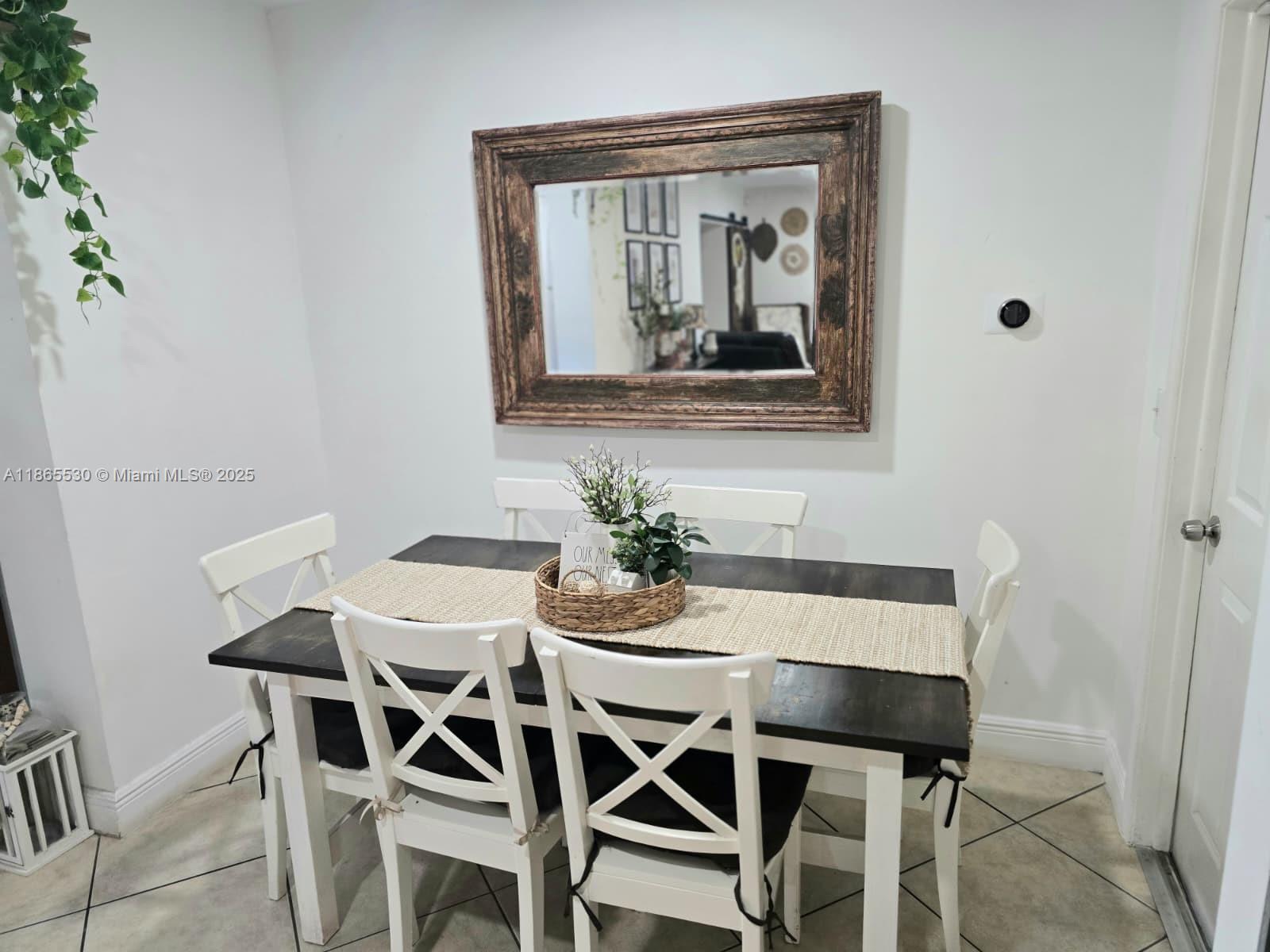 6120 Edwards Road Margate, FL 33063 - Photo 30 of 47 a dining room with furniture and window