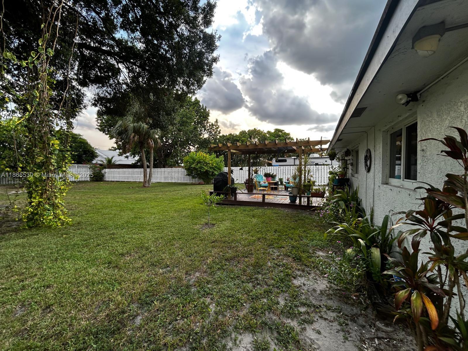 6120 Edwards Road Margate, FL 33063 - Photo 42 of 47 a view of a car park in front of house