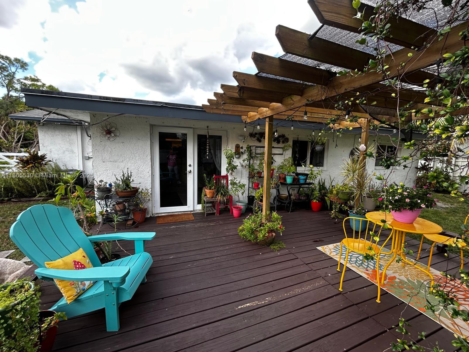 6120 Edwards Road Margate, FL 33063 - Photo 43 of 47 a view of a chairs and table in a patio