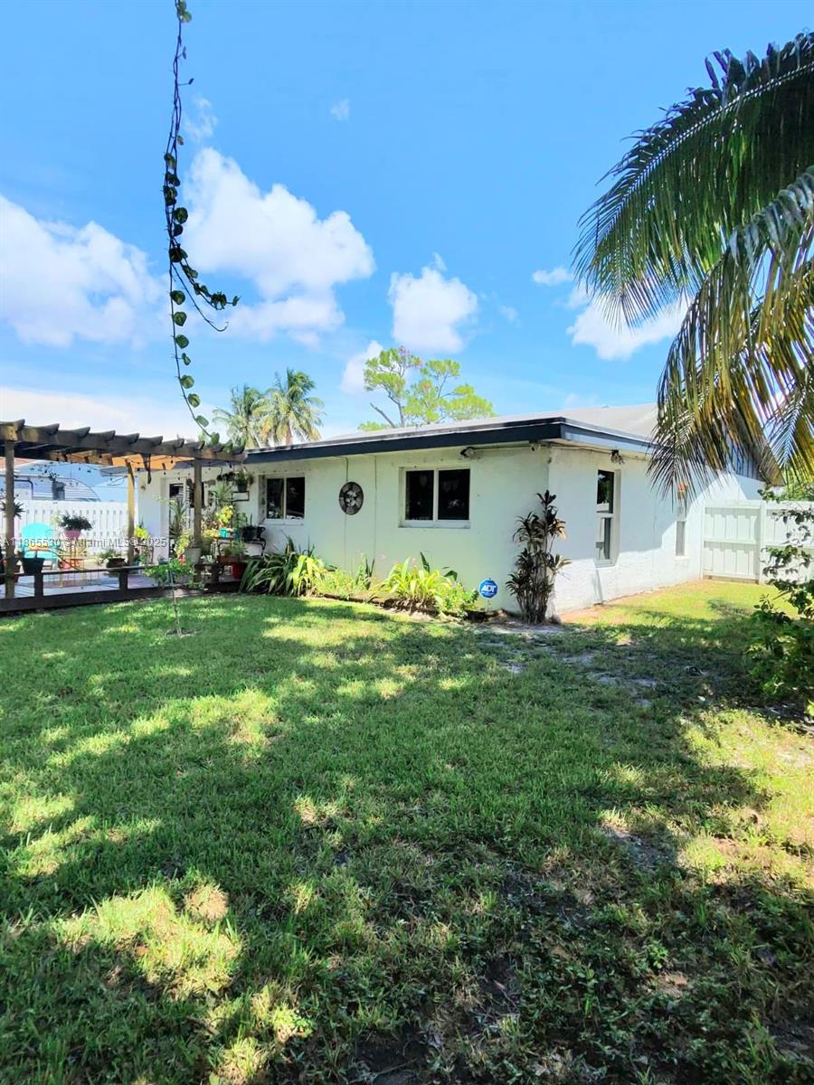 6120 Edwards Road Margate, FL 33063 - Photo 47 of 47 a front view of a house with garden