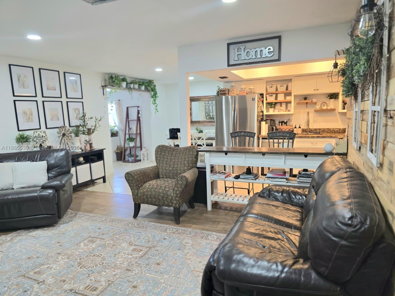 6120 Edwards Road Margate, FL 33063 - Photo 10 of 47 a living room with furniture and a large window